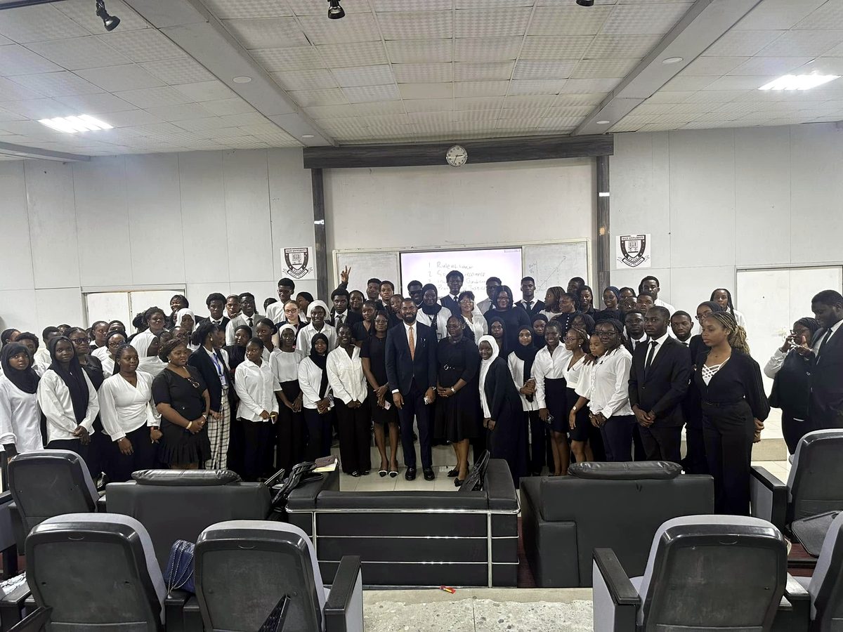 Deji Adeyanju with students in a lecture hall